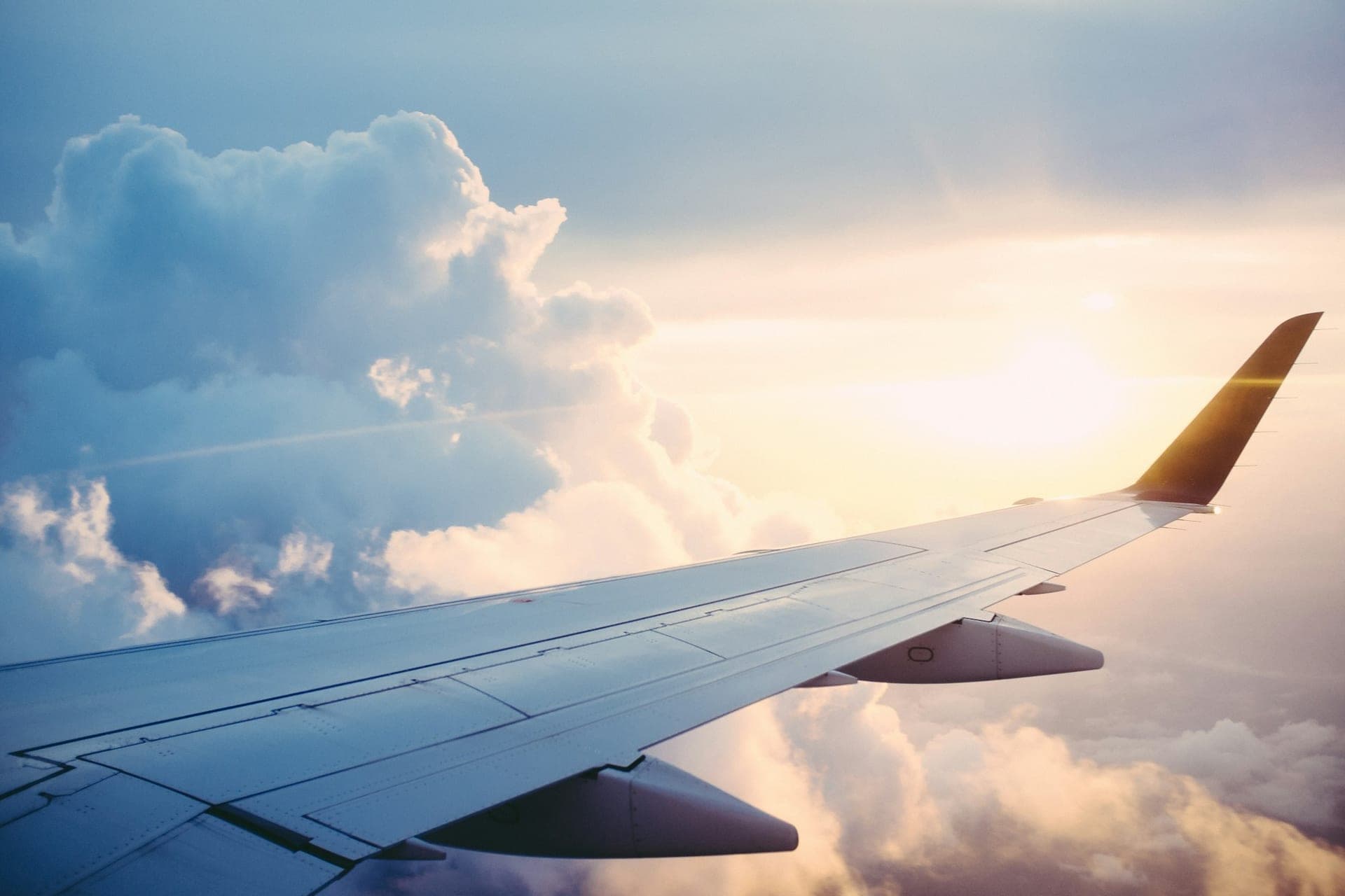 Aircraft wing over an evening sky on a global route